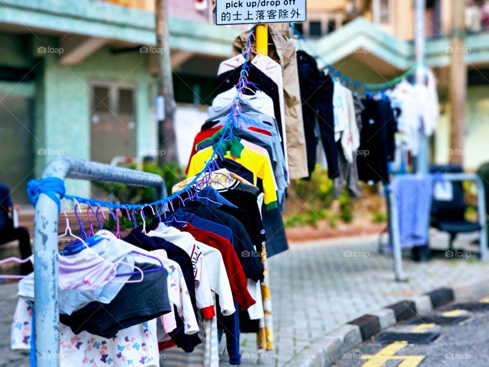 Clothes hanging publicly on the street