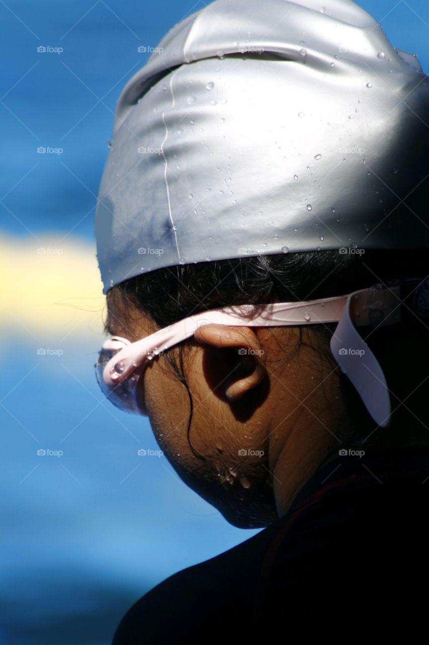 young kid prepares to swim in a swimming pool