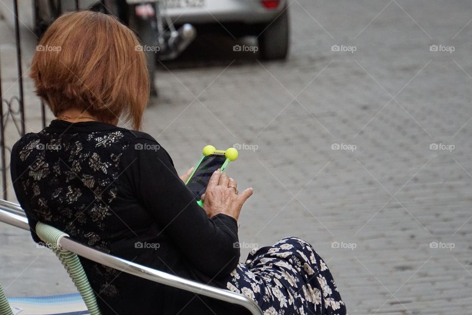 Lady on her mobile sitting on a bench