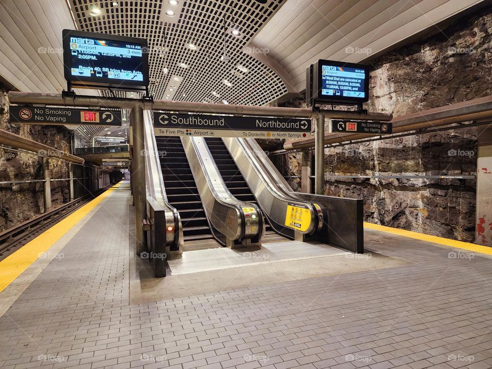 Escalators lead to a underground subway in Atlanta that looks remarkably similar to the Batcave