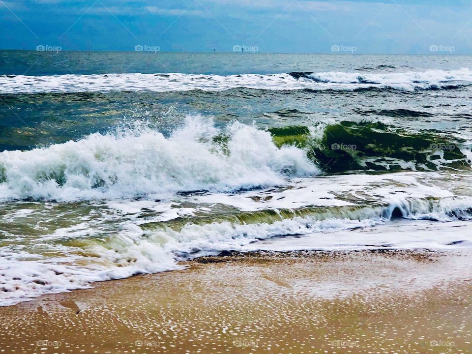 Waves crashing on the shoreline in the Gulf
