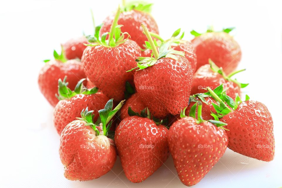 Fresh strawberry, sweet fruit, on white background.