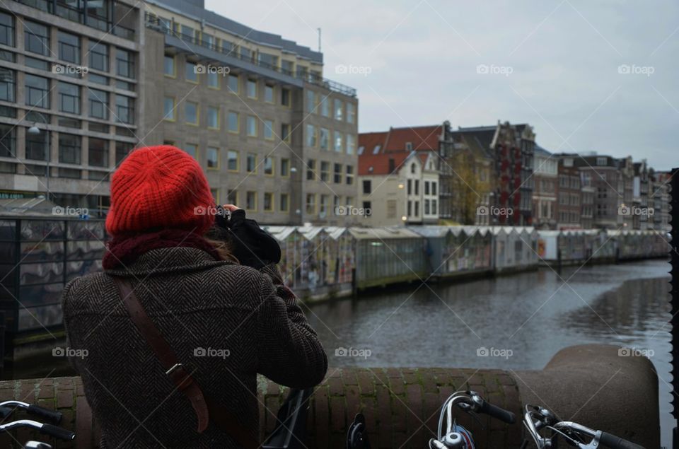 Photographer with red hat in Amsterdam