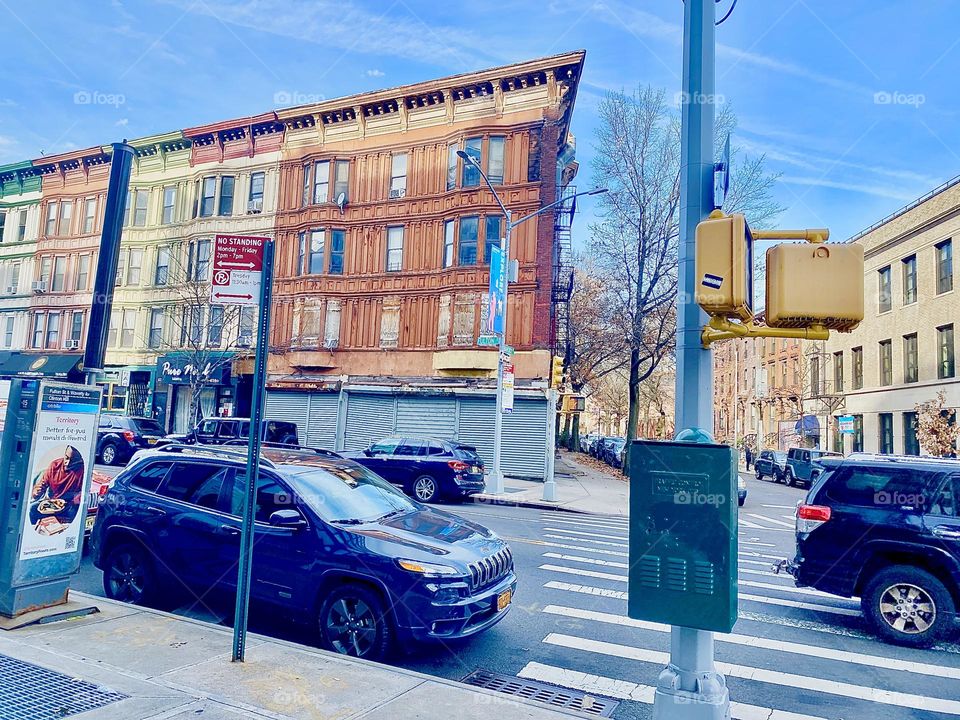 An interesting brownstone building in Fort Greene, Bklyn, NY seen from the Fulton Street side across the street on a sunny late afternoon in December 2021. Hypnotic Productions