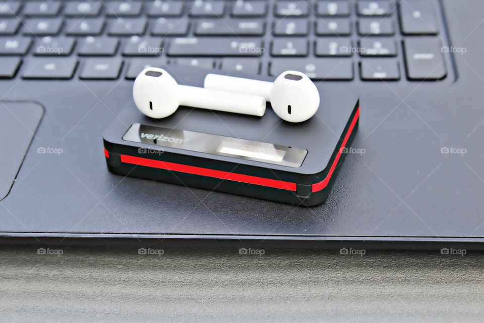 technology hotspot Wi-Fi earbuds laptop outdoors searching the internet on the world wide web while listening to music on my earbuds