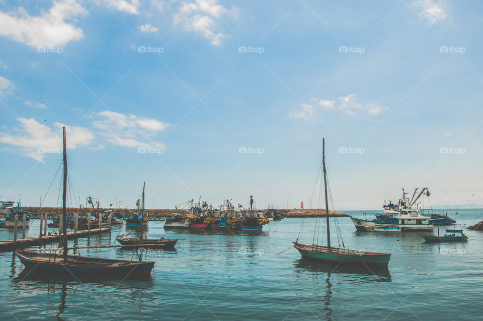 A bunch of boats in a small local port