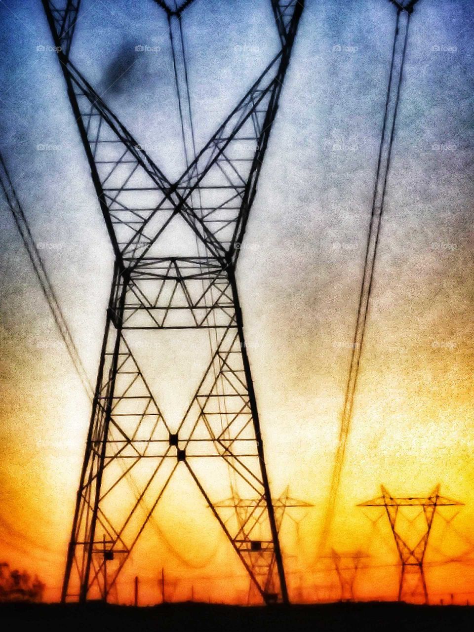 electric towers before sundown 108° desert summertime