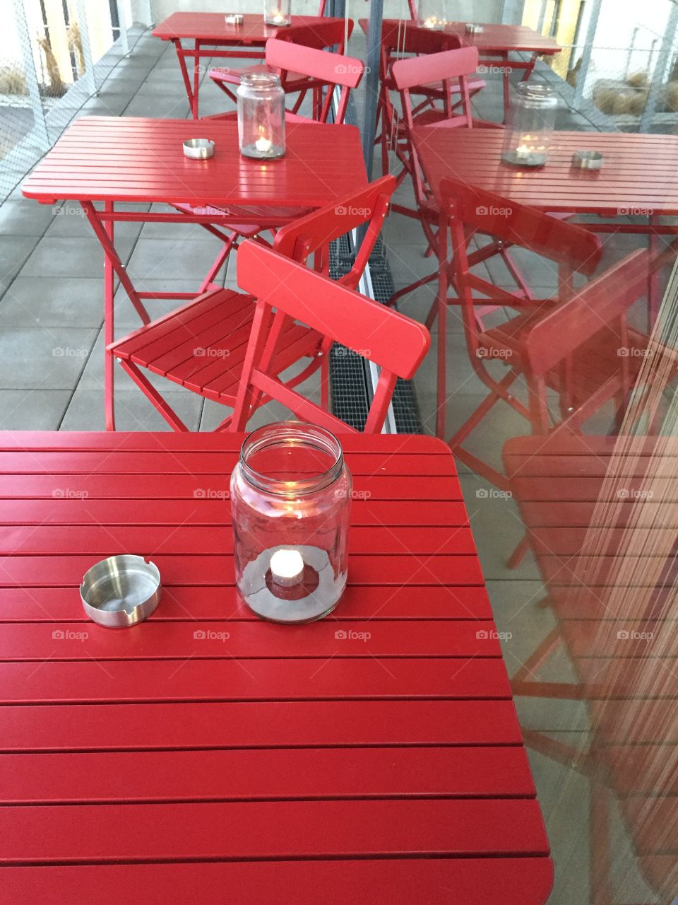 Red empty chairs and table