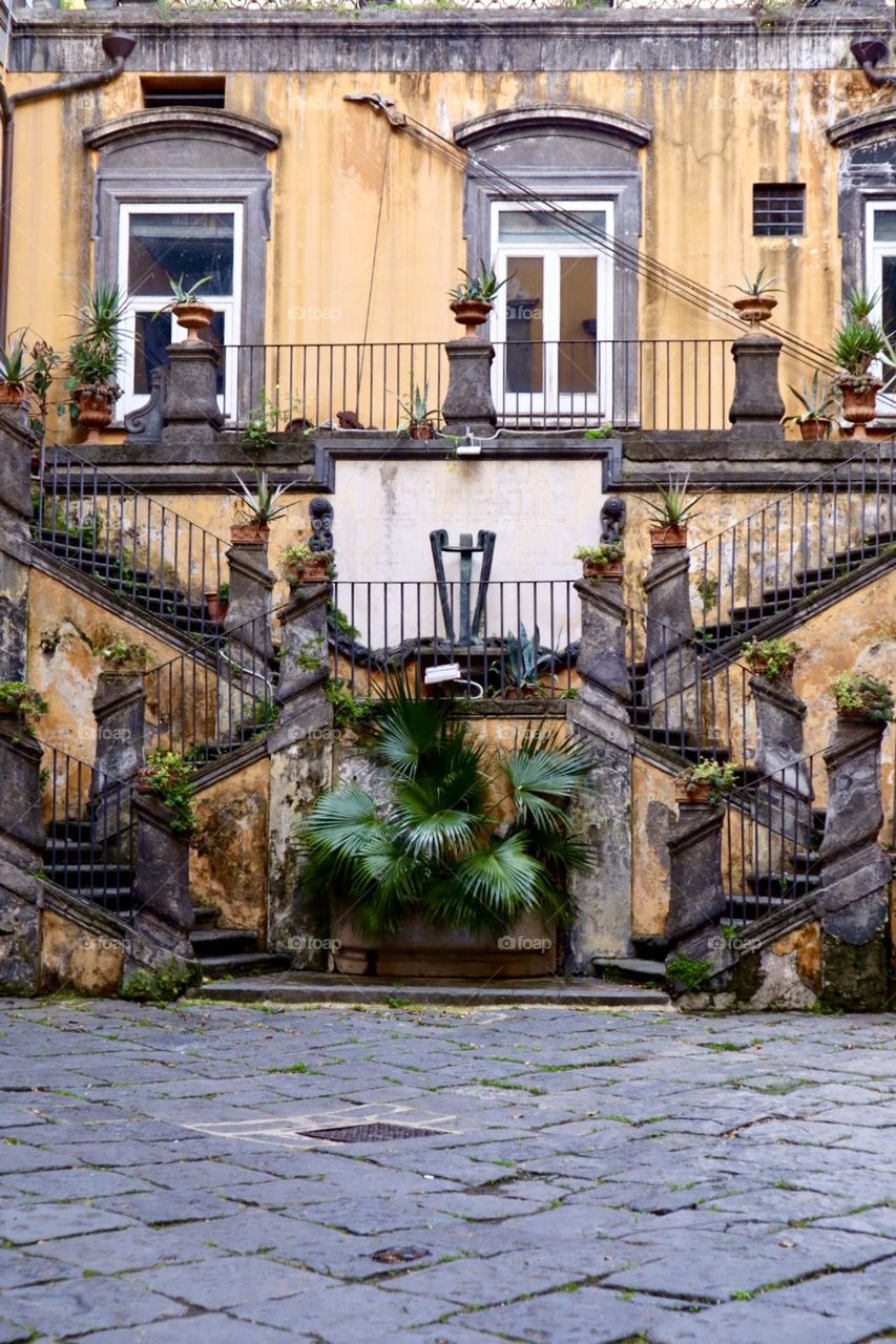 Old house with its stairs and balconies Napoli