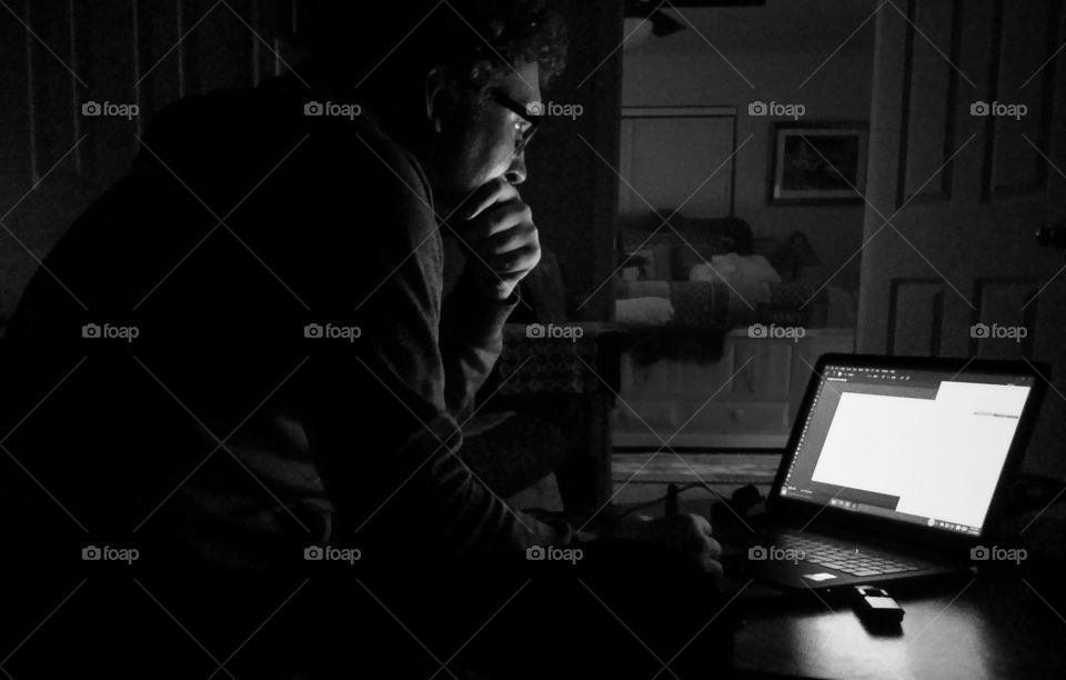 A man operating his personal computer