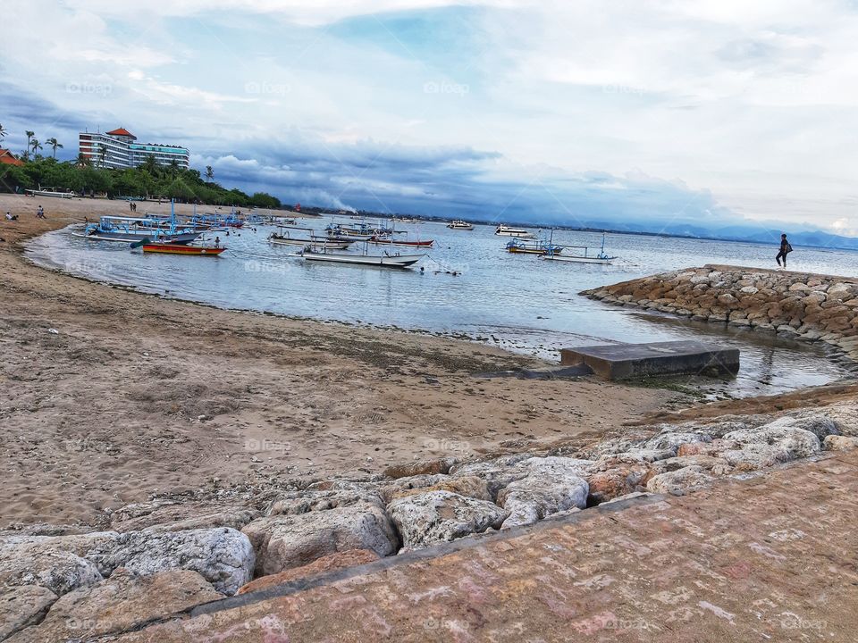 This is a photo of a Sanur beach view that is located in Bali. It can be seen that the beach is so peaceful where only few tourists come because of the pandemic of Covid -19.