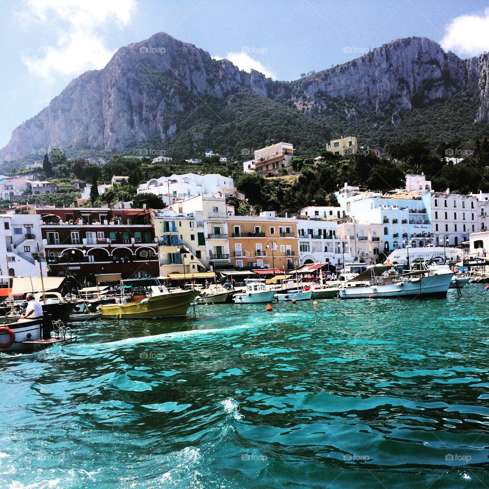 Capri, Italy . Pristine water and mountains of Capri, Italy.  View from harbor.