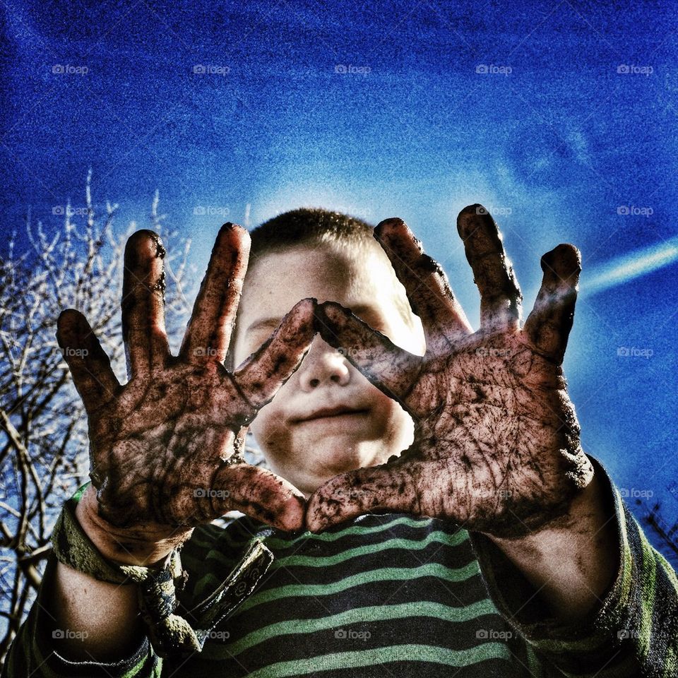 Boy showing his dirty hand