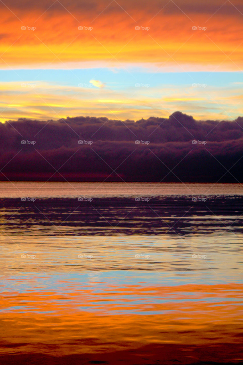 orange clouds reflexion thessaloniki by pablogarcia