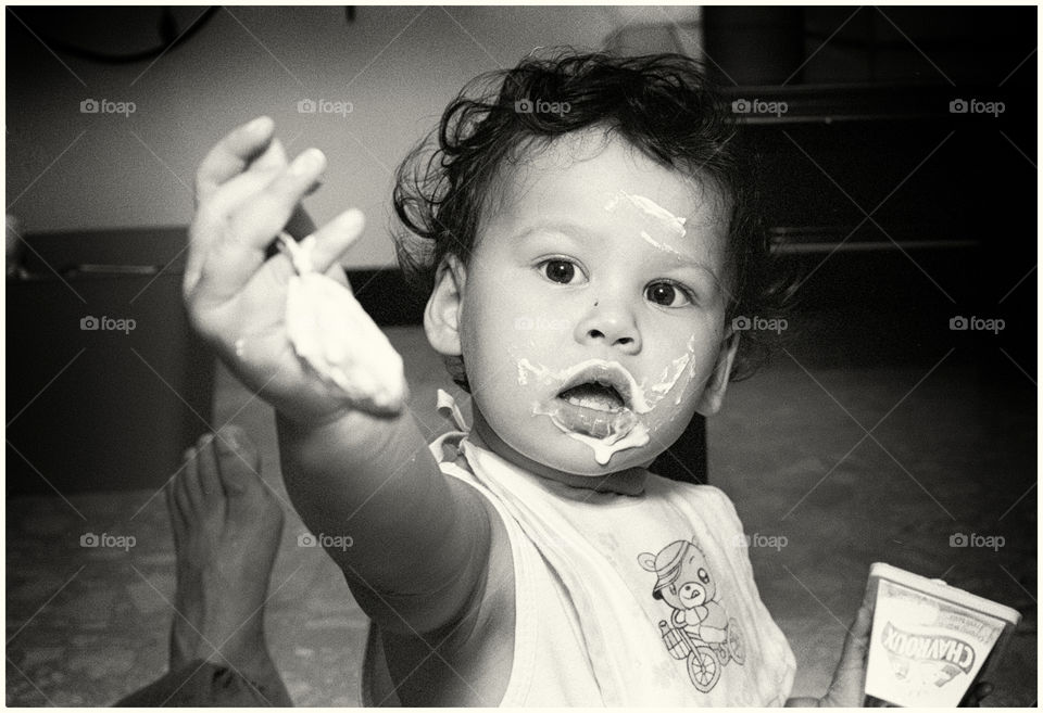 Baby girl feeding daddy