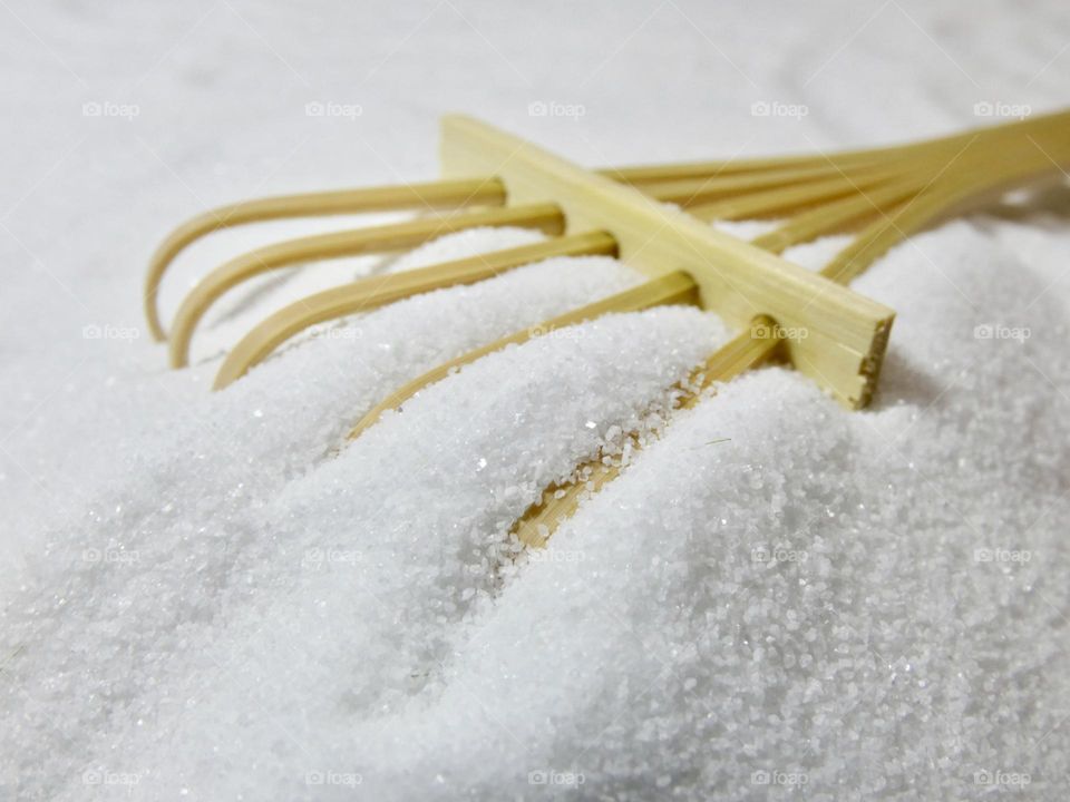 Close up of rake in sand of a Cocoro Zen Garden