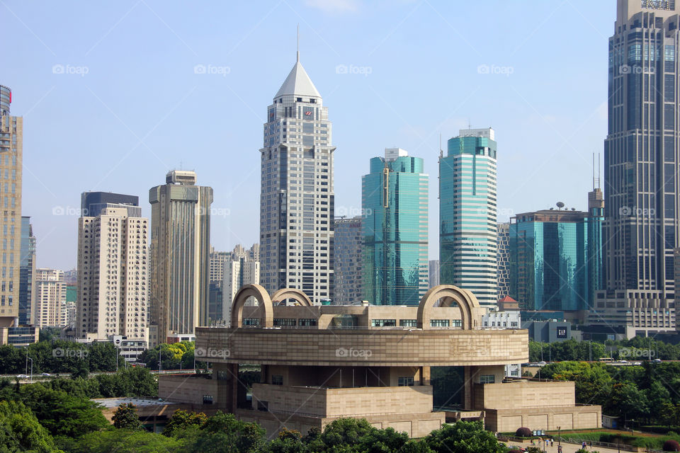 Shanghai museum view. A view of some sky scrapers in shanghai china. the building at the front bottom is the shanghai museum.