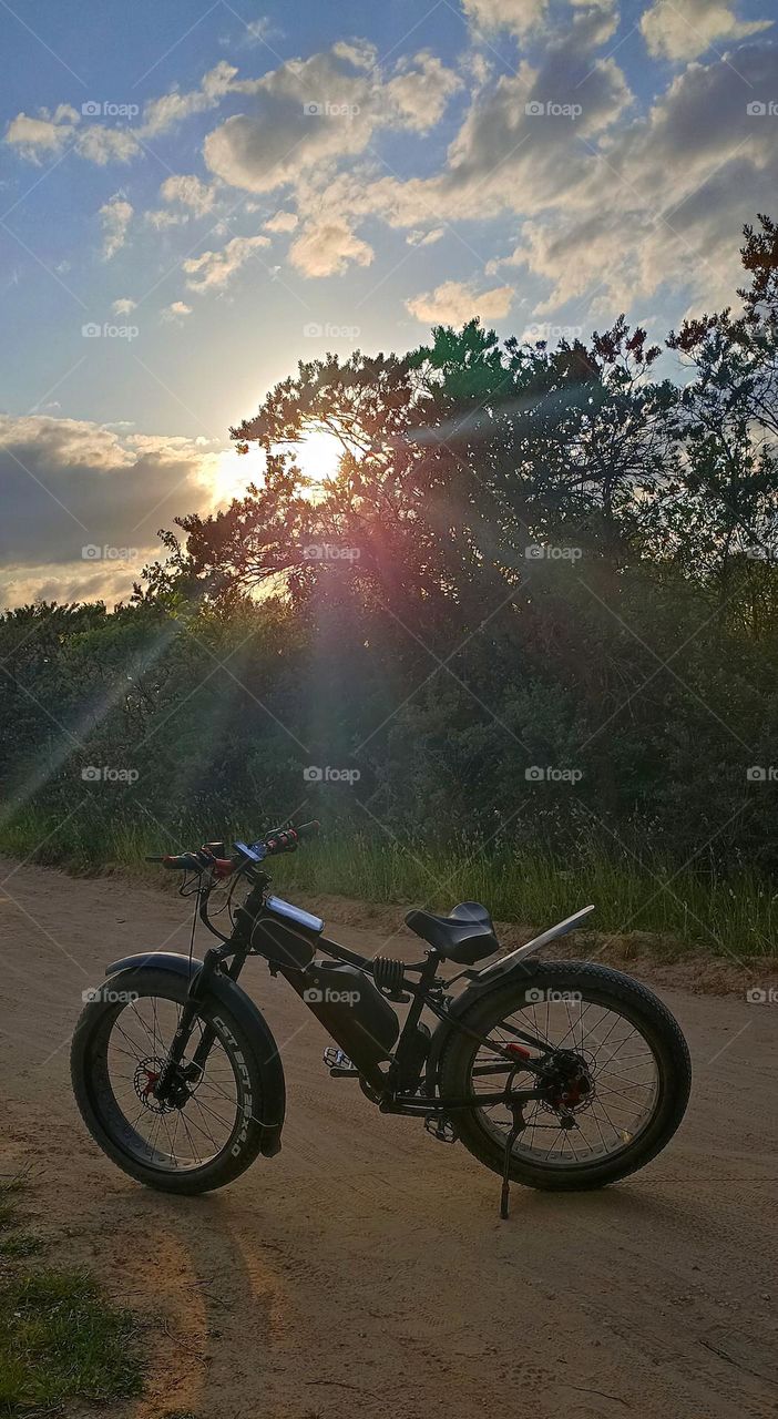 bike on a rural road in sunset