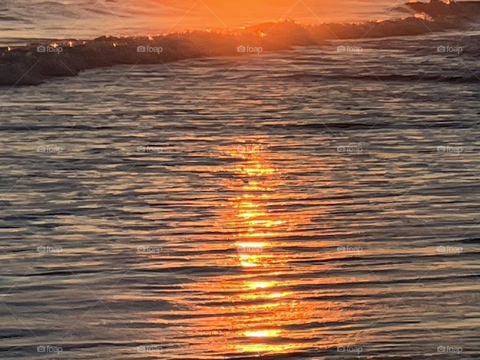 Sunset on beach water