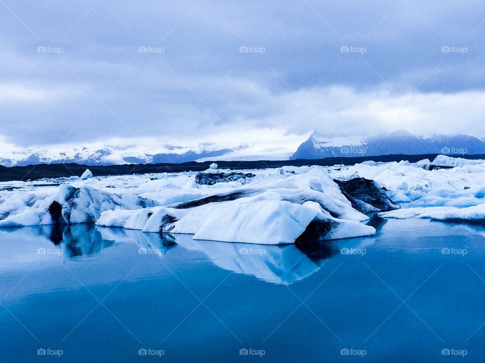 Glaciers reflecting on lake