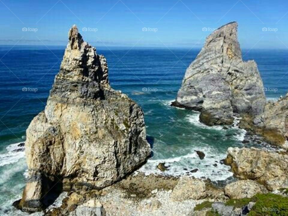 Praia da Ursa, Bear Beach. The legend says that the huge rock is the female bear transformed into a stone for disobeying the Gods' orders.