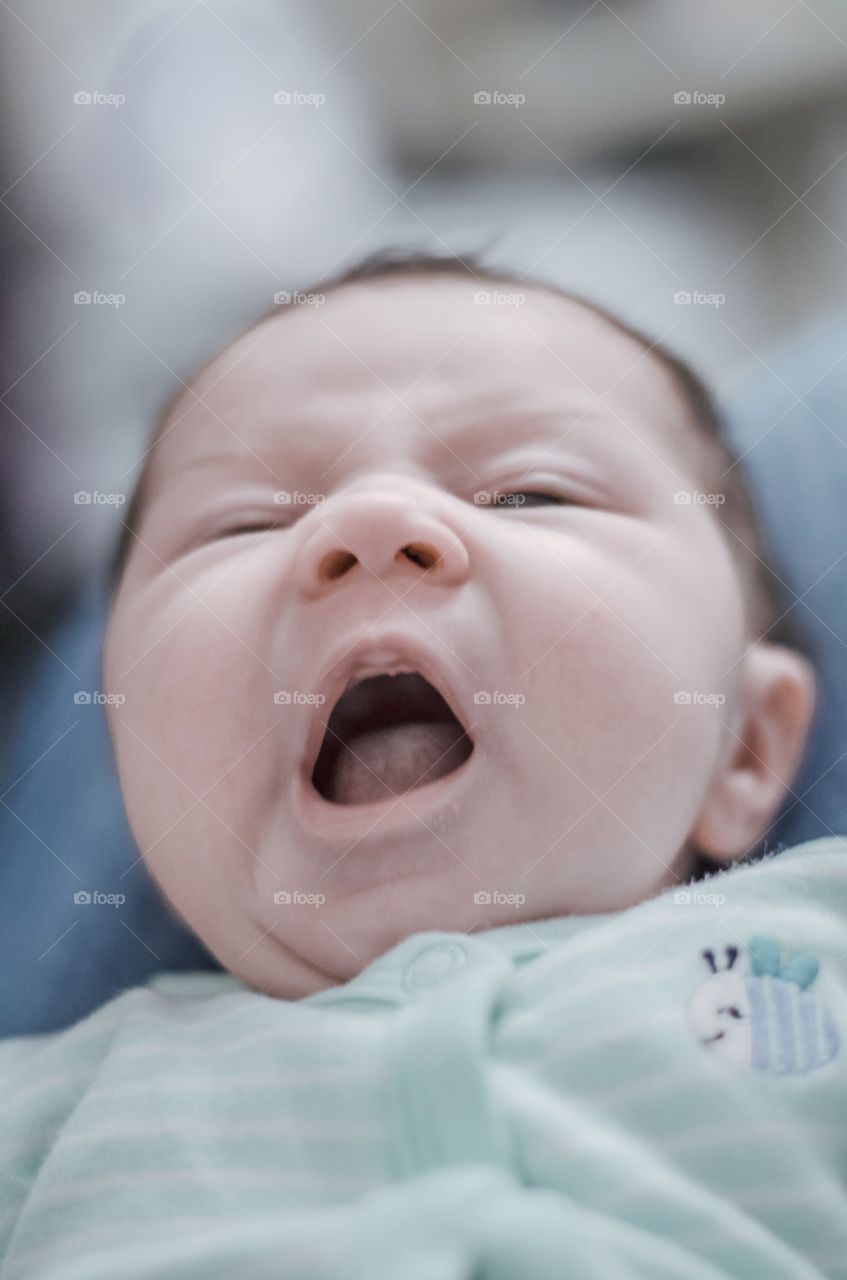 Close-up of baby boy yawing