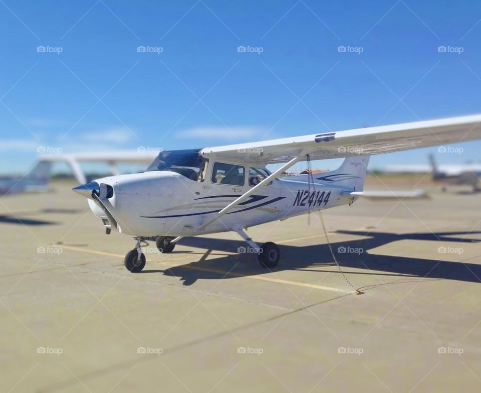 The aircraft in the image appears to be a Cessna 172. The registration number on the plane is N24144. Cessna 172s are popular single-engine, high-wing aircraft commonly used for flight training, personal use, and small cargo transport.