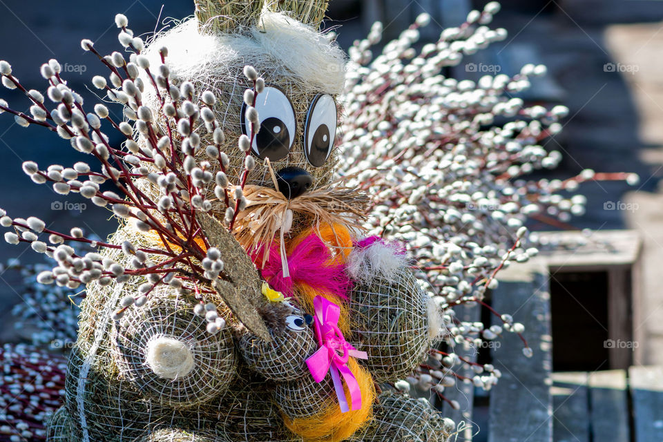 straw-shaped  bunny shapes with willow branches twings, easter holidays