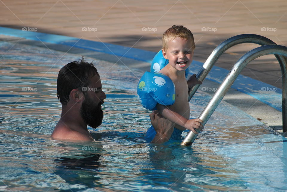 with daddy in swiming pool