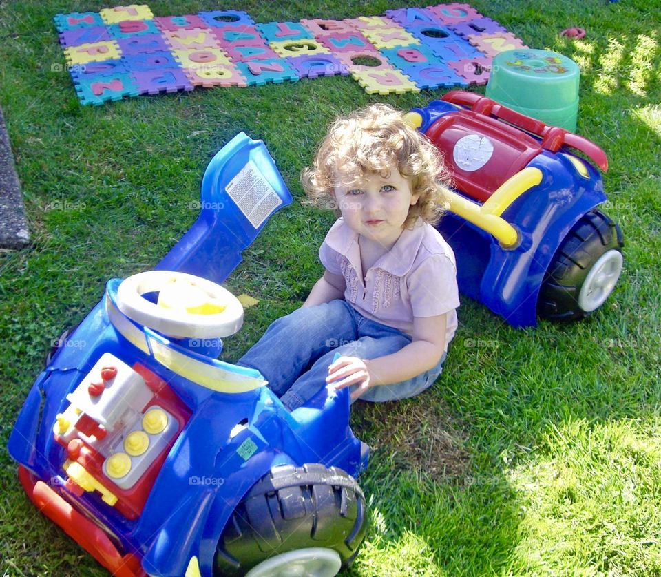 Toy car breaks in half as girl rides it 