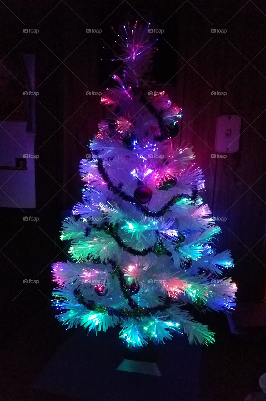Rainbow of colors in this table top Fiber Optic Christmas Tree