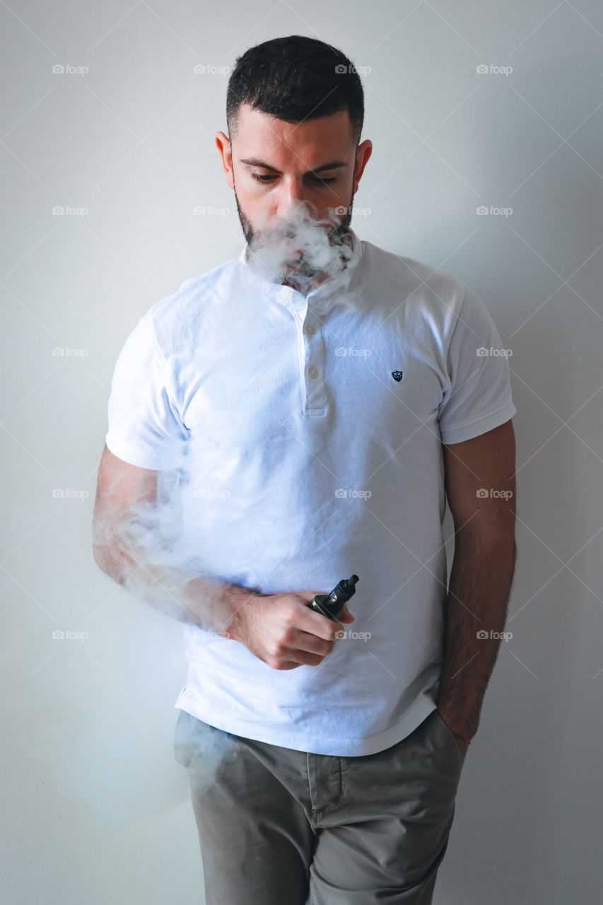 Man smoking while relaxed at home