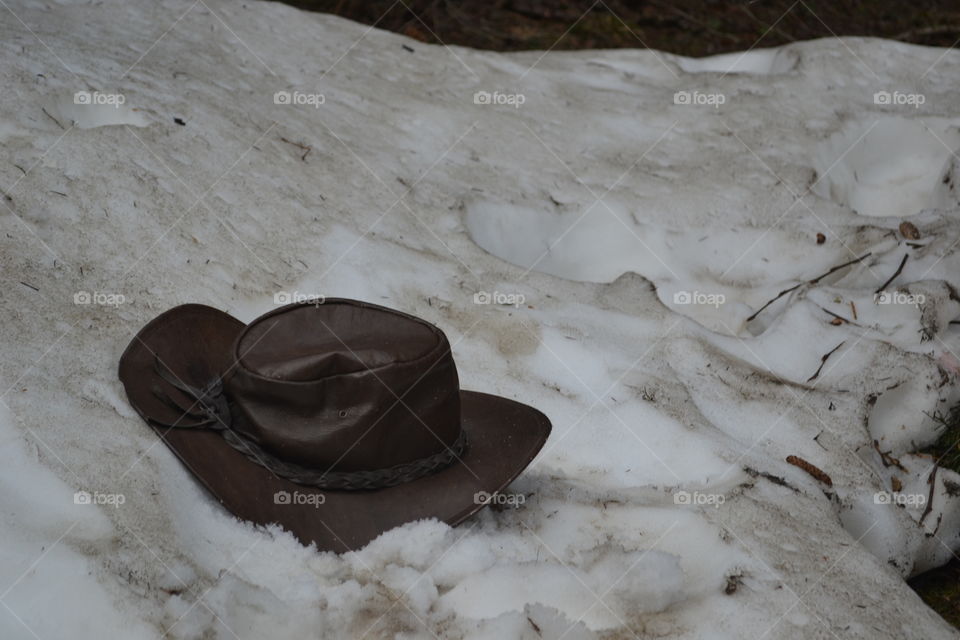 Australian leather bush hat on top of snow in Canada 