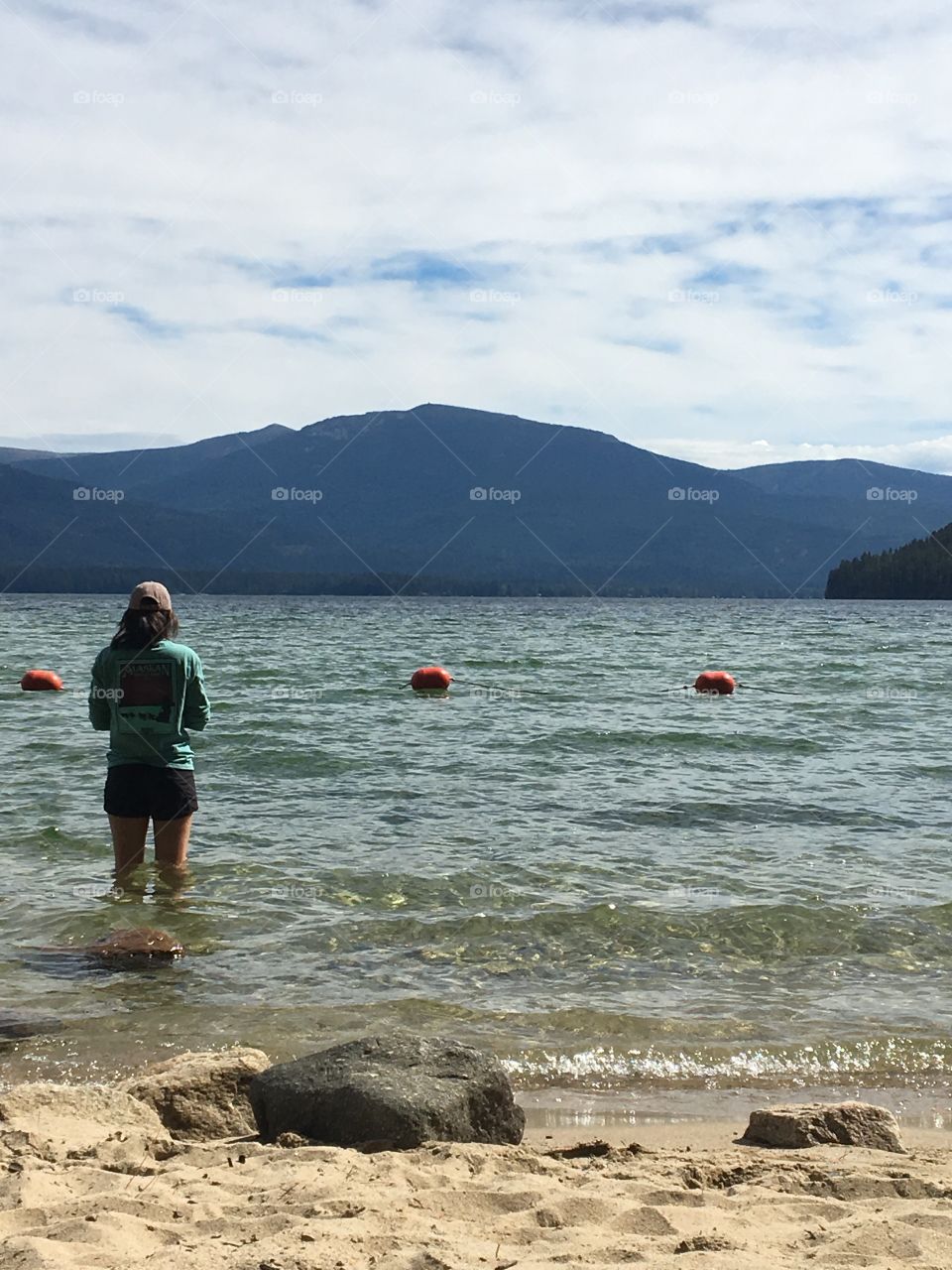 Woman pondering in lake
