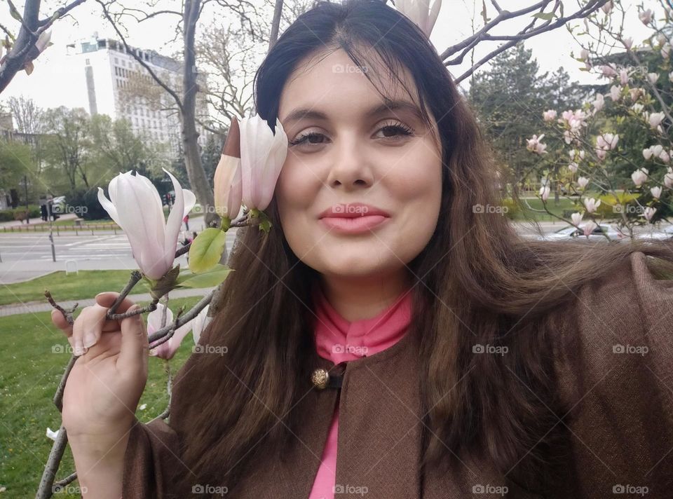 A selfie with a magnolia flower
