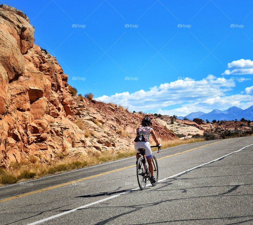 Girl on bicycle in Arches National Park