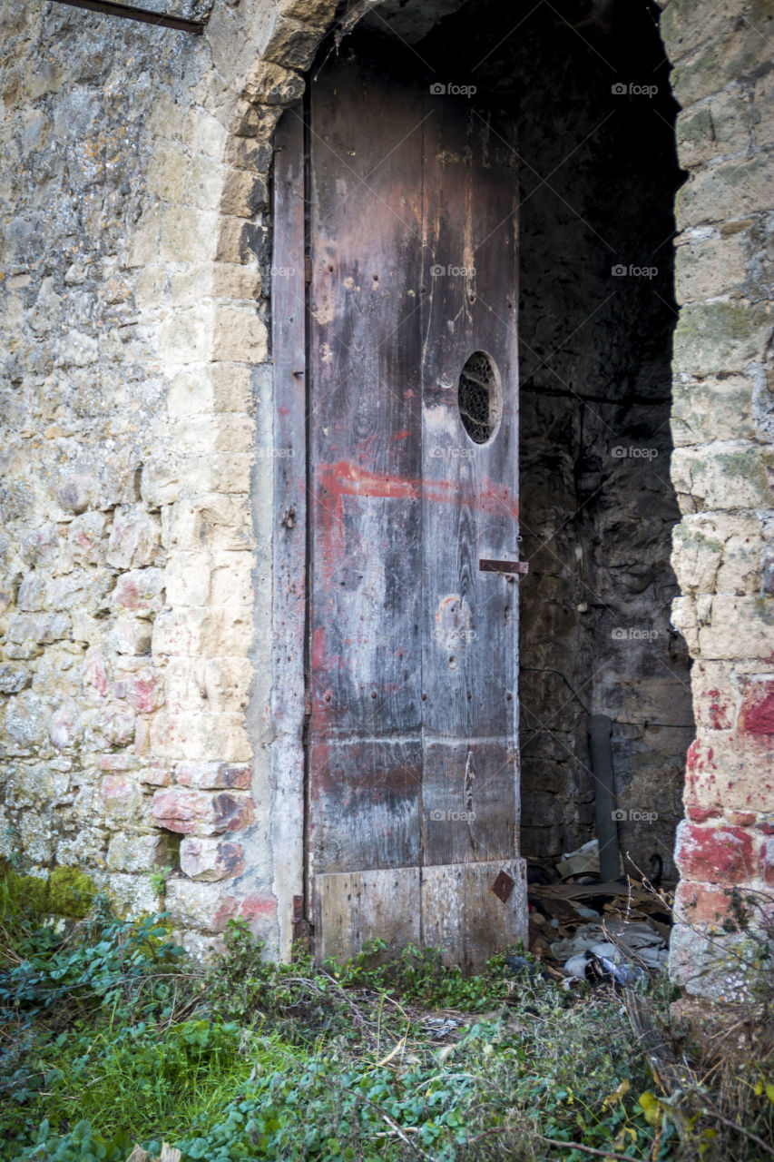 Old door of abandoned house 