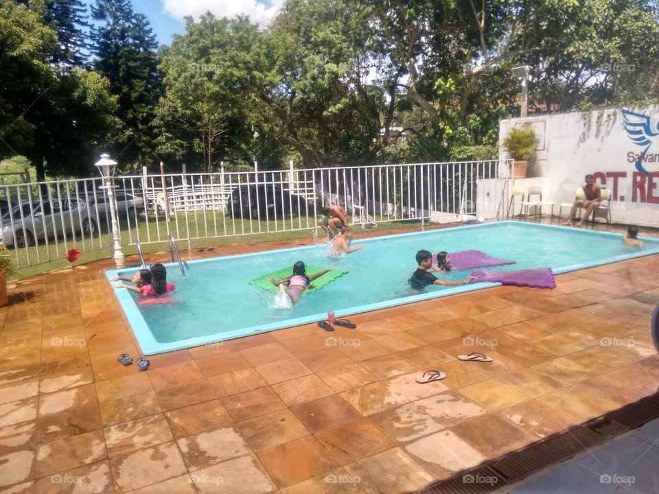 children playing in the pool