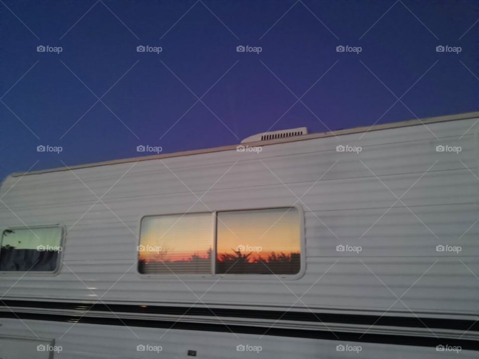 Sunset reflection in our camper window this evening.
