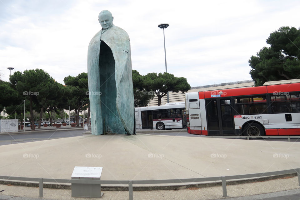 Rome, Italy. Conversazioni Pope John Paul II statue at Termini train station. A tall bronze sculpture, with a clock in the place of a body, dedicated to Pope John Paul II.