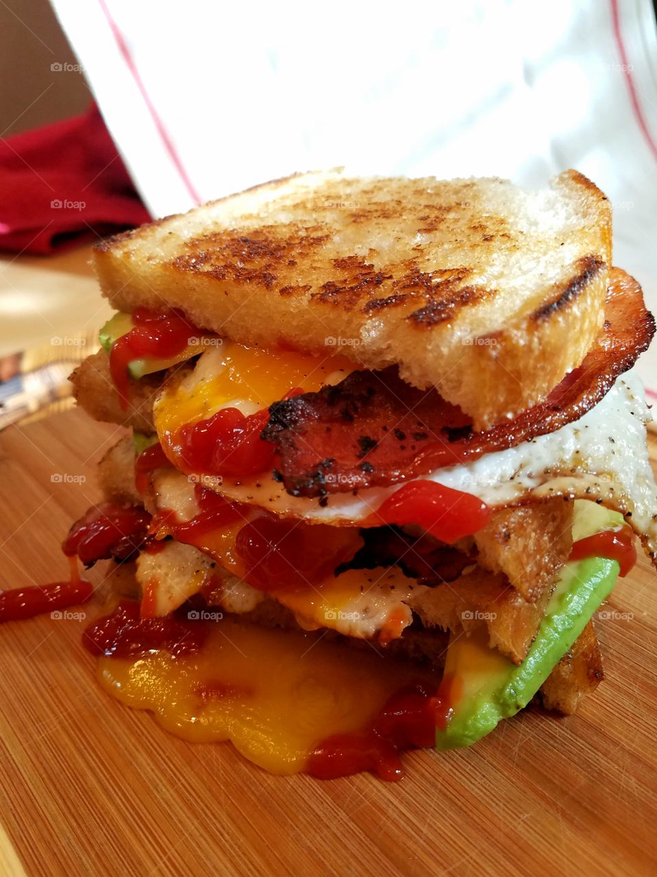 egg bacon avocado ketchup sandwich