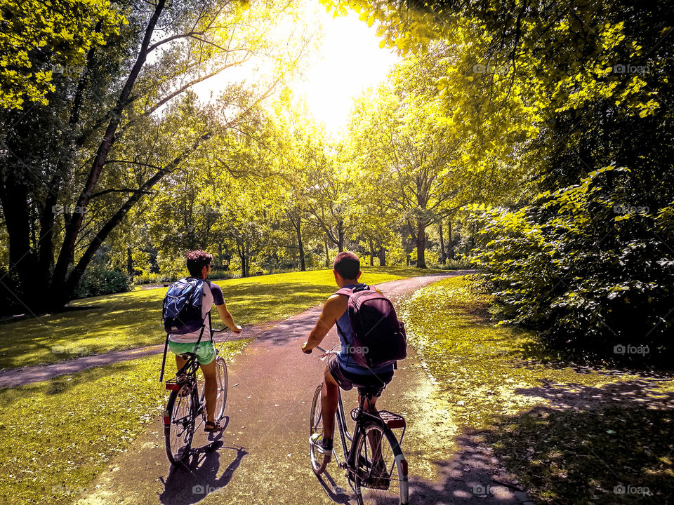 Bike ride through the park at sunset