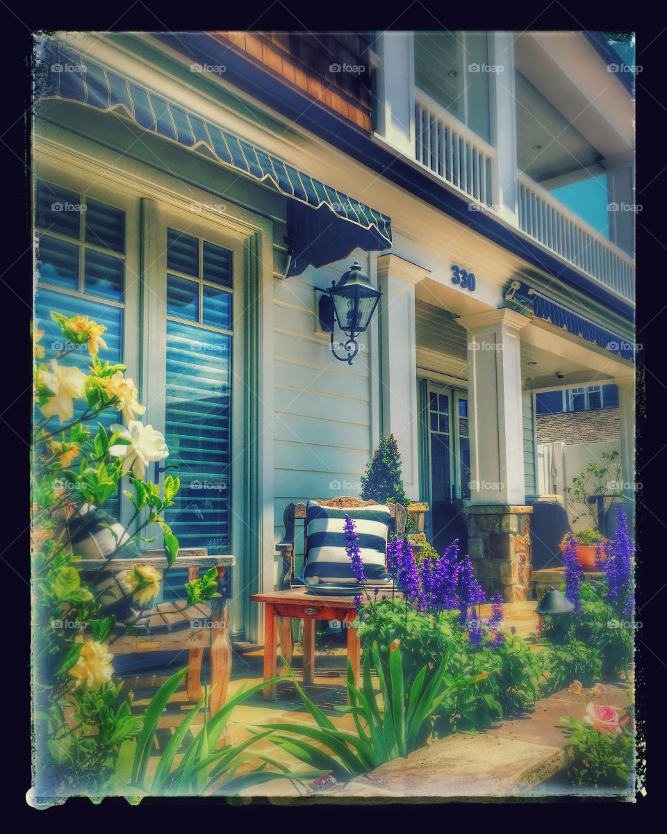 Beautiful house porch with flowers 
