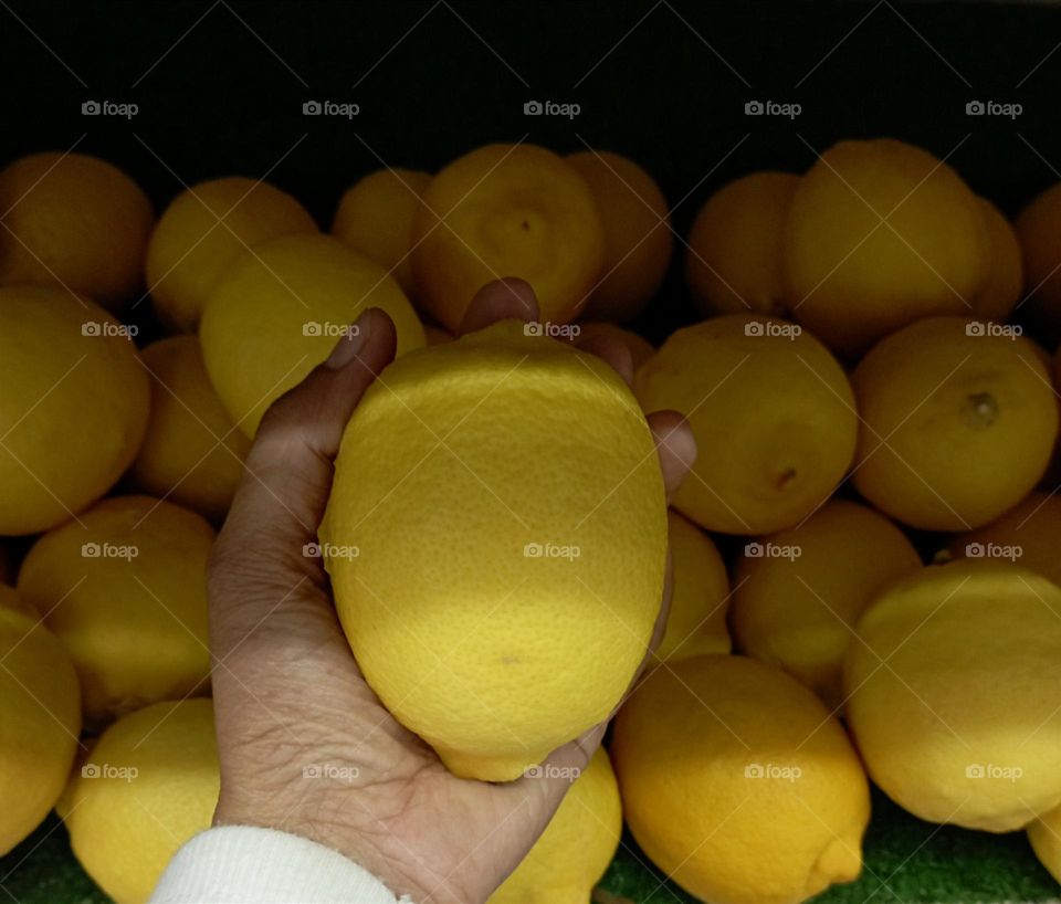 Lemon in a hand