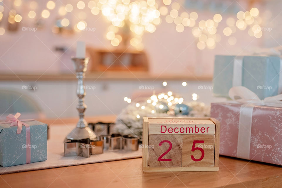 Christmas background with wooden block calendar with the date of December 25