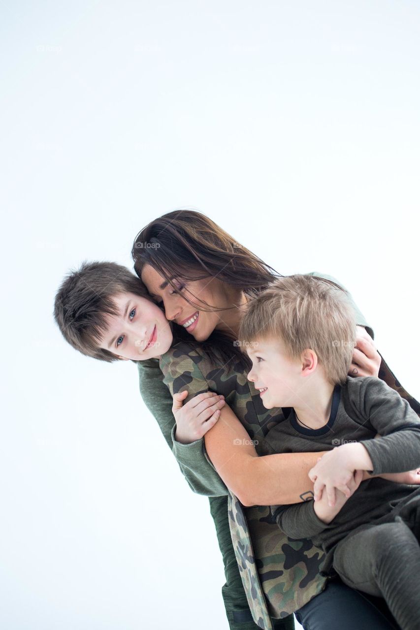 Mom and sons, tenderness moment, pure love