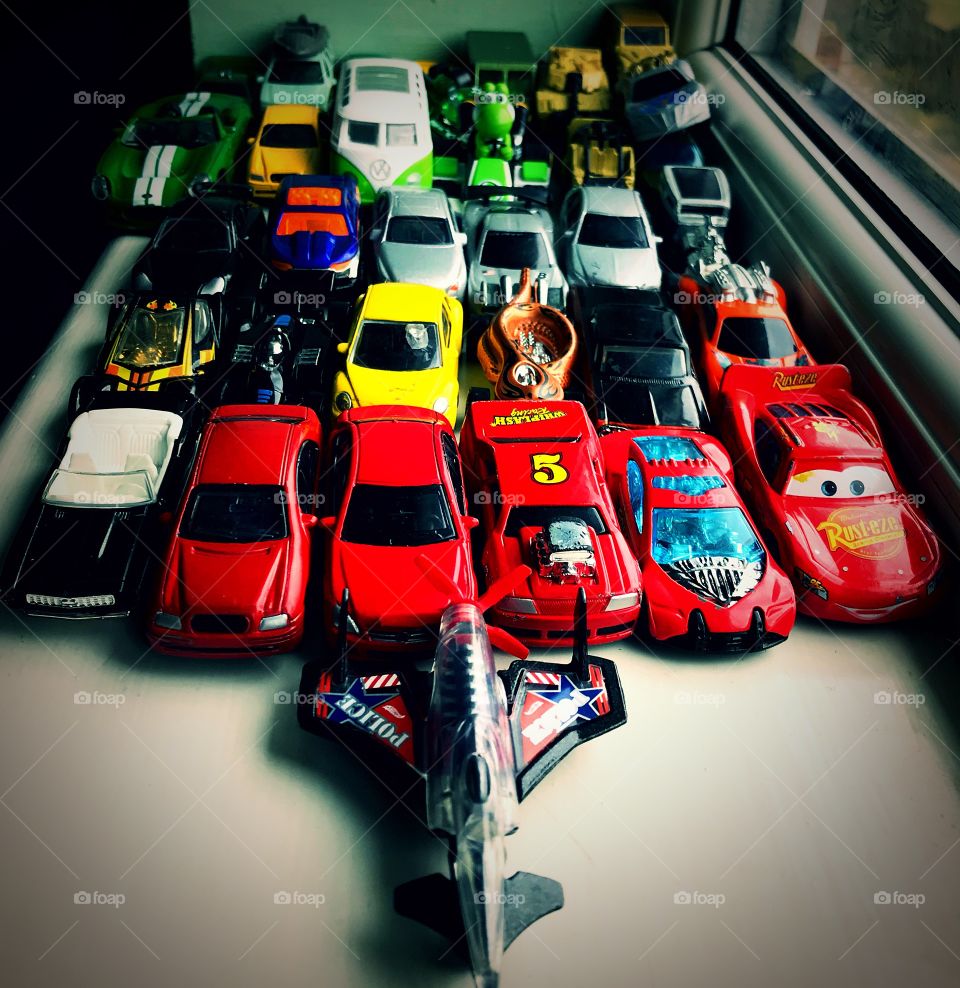 Cars ,toy cars ,red cars ,yellow cars, green cars, white cars an aircraft but mostly cars.......... did I mention.... cars? 