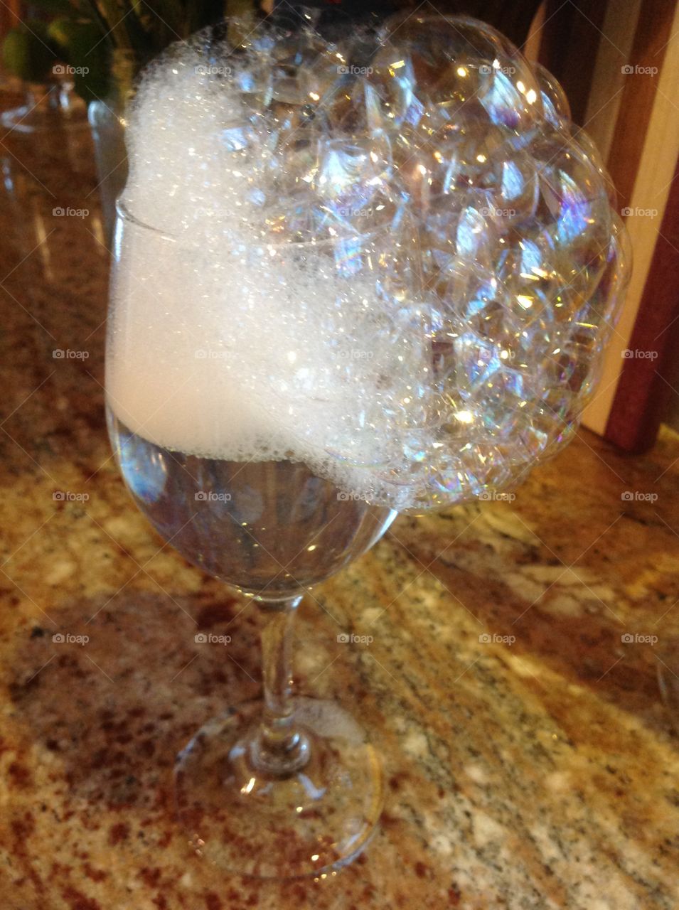 Bubbles flowing out of a glass.