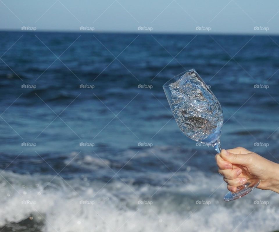 Sea#waves#sky#wineglass#hand#nature