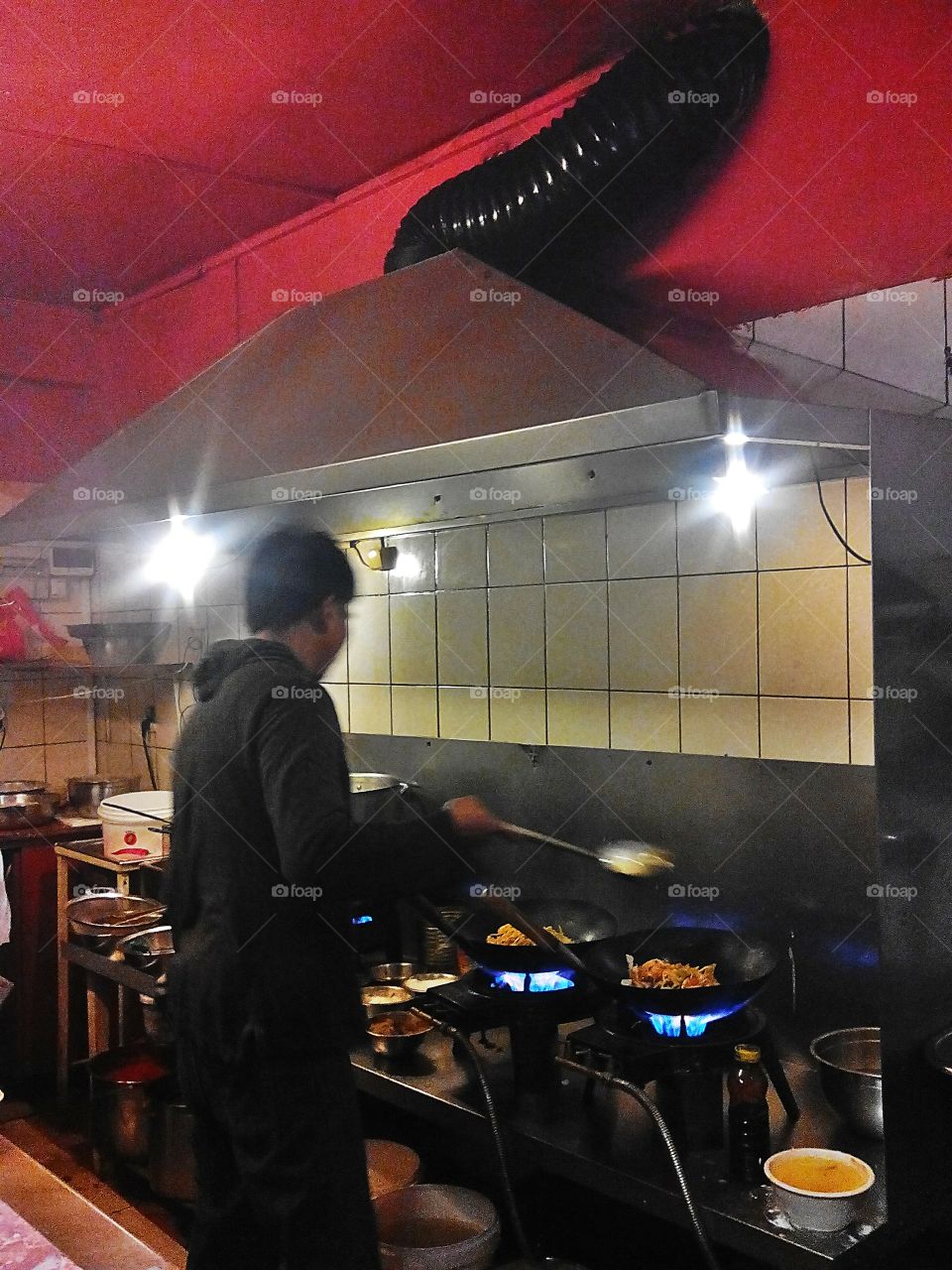 In Viet-Thai restaurant . Vietnamese chief preparing delicious food 